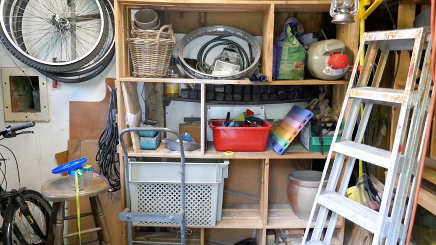 messy garage before spring cleaning, throwing items out of the garage